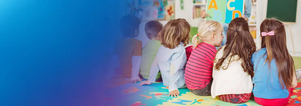 Women standing infront of children