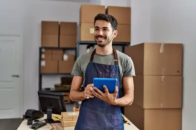 An young  business worker using touchpad at storehouse