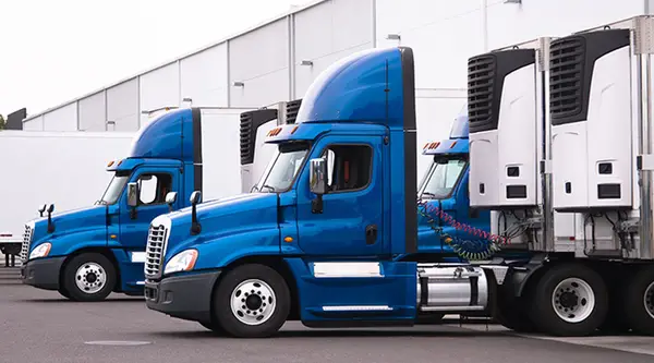 refrigerator trucks on a loading dock