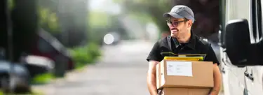 Man holding shipping boxes